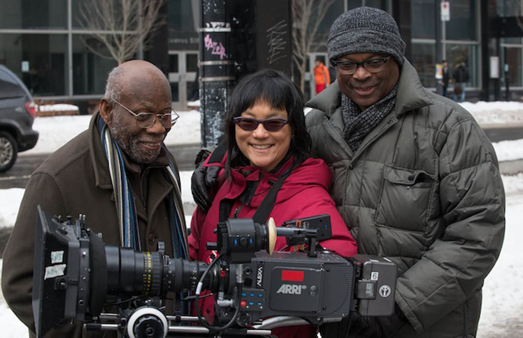 Concordia professor Clarence Bayne (left), director Mina Shum and producer Selwyn Jacob across the street from the Henry F. Hall Building of Concordia University. (National Film Board of Canada photo.)