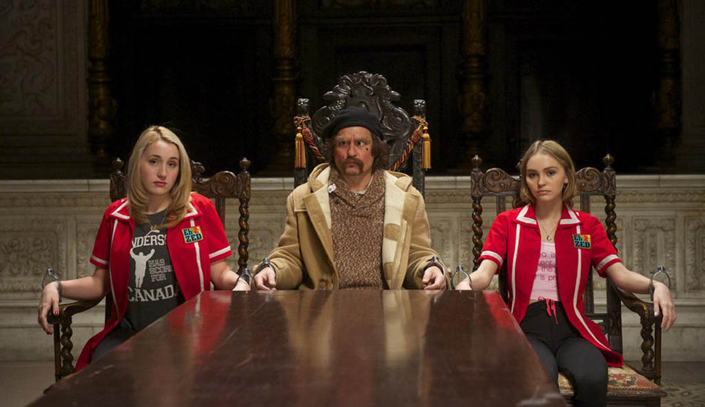 Colleen M (Harley Quinn Smith) left, Guy Lapointe (Johnny Depp) centre, and Colleen C are held prisoner in a secret, underground lair in Kevin Smith's film Yoga Hosers.