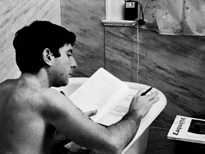 Leonard Cohen in his bath tub. Notice the Esquire magazine. Product placement? What's that on the window ledge? Could it be. . .a transistor radio? Ask an old person.
